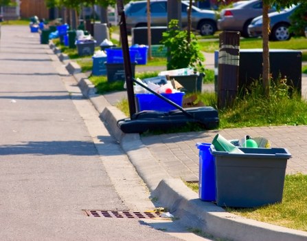 Workers managing builders waste clearance efficiently